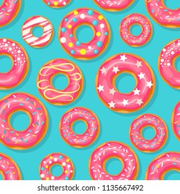 Donut seamless pattern. Pink donut with different topping on blue background