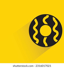 donut with shadow on yellow background