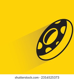 donut with shadow on yellow background
