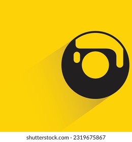 donut with shadow on yellow background