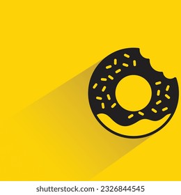 donut with shadow on yellow background