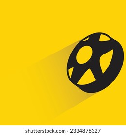 donut with shadow on yellow background