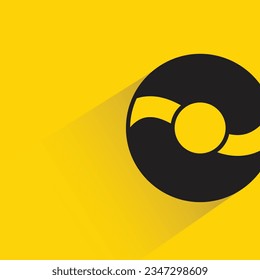 donut with shadow on yellow background