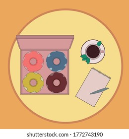 
Donuts, una taza de té y una libreta