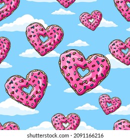 Donuts hearts with pink glaze and colored sprinkles  on blue sky background.  Seamless pattern. Texture for fabric, wrapping, wallpaper. Decorative print.