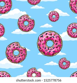Donuts with pink glaze and colored sprinkles  on blue sky background.  Seamless pattern. Texture for fabric, wrapping, wallpaper. Decorative print.