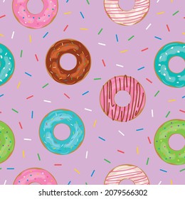 Donuts seamless pattern with icing in sprinkles on a pink background.