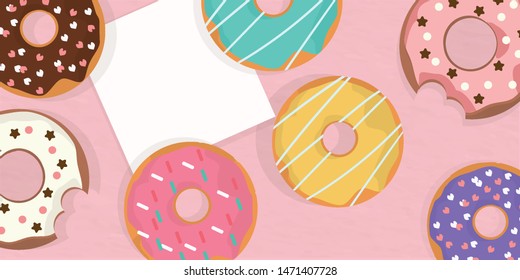 Donuts set cover pink paper background sweet lover and bakery chocolate glaze with sprinkle.note paper on top view with colourful donut and bite donut so delicious yummy food.