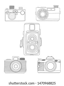 Doodle analog cameras over white bakcground, hand drawn vector