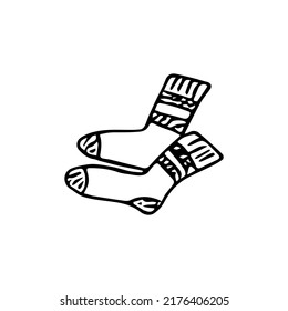 Doodle autumn socks, hand drawn warm clothes for winter weather, knitted accesories.Sketch,freehand minimalistic design, child drawing.Isolated.Vector illustration