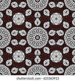 Doodle background in vector with doodles, flowers and paisley. Vector ethnic pattern can be used for wallpaper, pattern fills, coloring books and pages for kids and adults. Brown background.