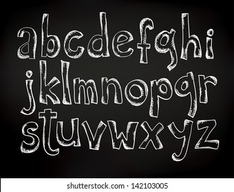 Doodle chalk drawn alphabet on a black board