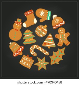 Doodle Christmas gingerbread cookies with icing composed in circle shape on the blackboard.