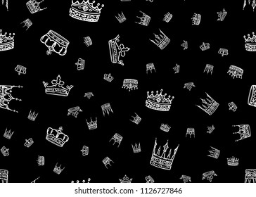 Doodle crown seamless pattern. Scattered hand drawn crowns on black background. Vector illustration for print, textile, paper.