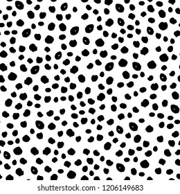 Doodle dot pattern with scattering hand-drawn round blots isolated on white. Modern stylish texture with points. Monochrome minimalistic graphic element.