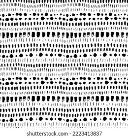 Doodle dotted lines seamless pattern. Brush drawn horizontal dashes, dots, spots, circles and small lines. Black and white abstract wave pattern. Sketchy hand drawn points texture.