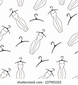 Doodle dresses and hangers seamless pattern. Monochrome background