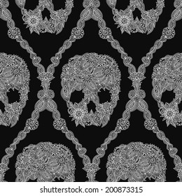 Doodle floral skulls damask seamless pattern in white over black.