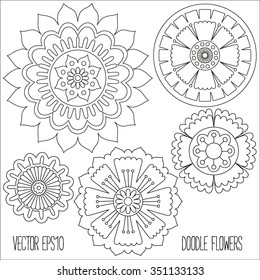 Doodle flowers set. Hand drawn isolated graphic elements. Boho and ethnic style mandala. Decorative art for birthday cards, wedding and baby shower invitations, scrapbooking etc. Vector illustration.