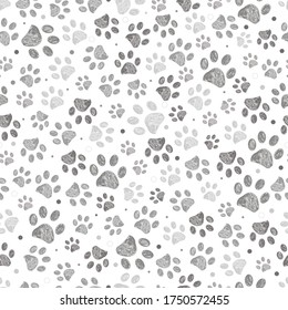 Doodle grey paw print seamless fabric design repeated pattern with grey background