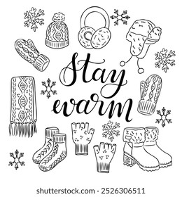 Doodle hand drawn set of warm winter accessories with calligraphy text Stay warm. Hats, gloves, boots, scarf isolated on white background. Clothing design for winter season for coloring pages, sticker