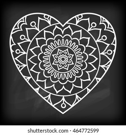 Doodle heart mandala on chalkboard. Outline flower in a heart shape. Coloring book pattern. Decorative round flower. Wedding invitation, baby shower design lelement. Vector illustration.