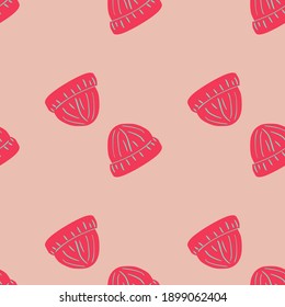 Doodle hipster seamless pattern with bright pink beanie hat silhouettes. Pastel background. Hand drawn print. Stock illustration. Vector design for textile, fabric, giftwrap, wallpapers.