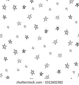 Doodle little stars seamless pattern. Black small star illustration on white background in hand drawn hipster style.