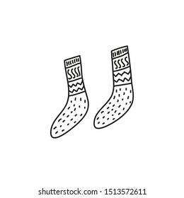 Doodle outline pair of long socks isolated on white background.
