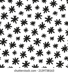 Patrón de garabatos con copos de nieve. La nieve manuscrita se tiñe de color negro sobre fondo blanco para textura de invierno. Resumen de un patrón sin fisuras para el diseño de productos de Año Nuevo, portadas de vacaciones, fondos de pantalla. 