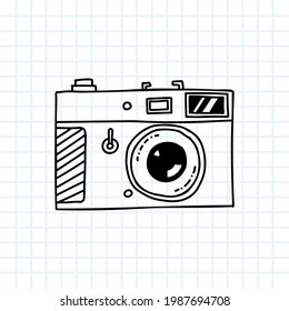 Doodle photo camera sketch. Vintage cartoon handdrawn lens, monochrome line icon. Vector illustration