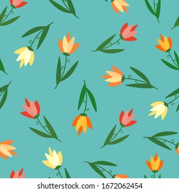 Doodle red, orange, yellow and pink tulip flowers on calm blue background. Seamless spring natural pattern. Suitable for packaging, wallpaper, textile.