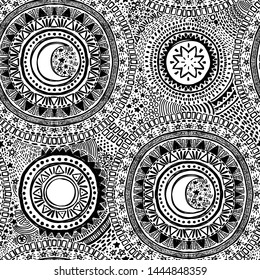Doodle seamless pattern with black mandala ornament, stars and moons on white background, sketch style vector illustration