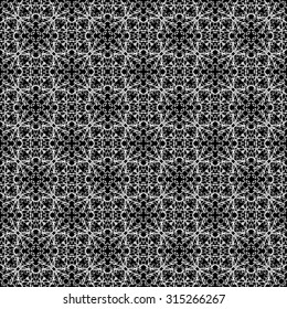Doodle seamless pattern in black and white. 
Hand drawn ornamental wallpaper or textile pattern with white calligraphy motives on black background in vector format. 