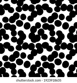 Doodle seamless pattern with chaotic dots. Big black dots on white background. Abstract textured template.