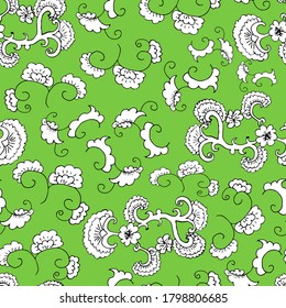 Doodle seamless pattern. Floral ornament. Wallpaper, textile, wrapping paper. Green background. Hand drawn Vector illustration.