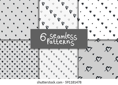 Doodle seamless pattern set with hearts. Six vector valentines day backgrounds. Black and white.