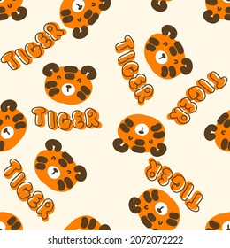 Doodle seamless pattern with tiger faces and text TIGER. Perfect for T-shirt, textile and print. Hand drawn vector illustration for decor and design.
