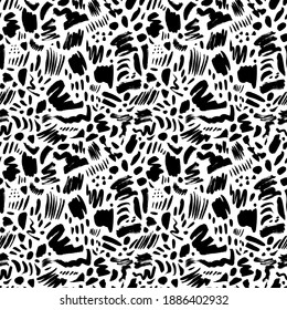 Doodle shapes and scratched lines seamless pattern. Vector abstract dots, brush strokes, bold funky drawing elements. Hand painted ink background. Art illustration for fashion designs in trendy style