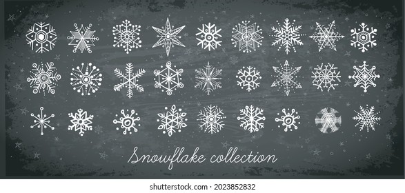 Doodle snowflakes hand drawn with white chalks on blackboard background
