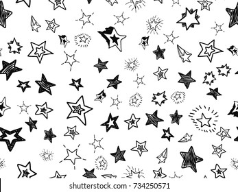 Doodle star confetti seamless pattern. Hand drawn stars background. Vector illustration for print, textile, paper.