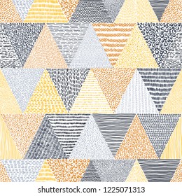 Doodle style seamless pattern. Hand-drawn triangles on white background. Vector illustration.