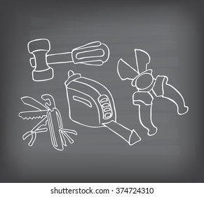 doodle tools set on blackboard