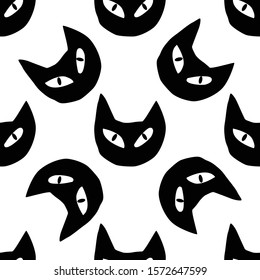 Doodle vector seamless pattern of funny black cat faces isolated on white background for your design
