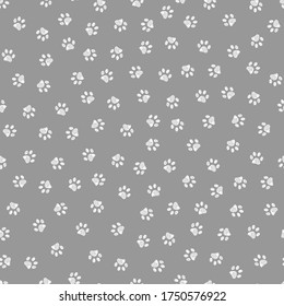 Doodle white paw print seamless fabric design repeated pattern with grey background