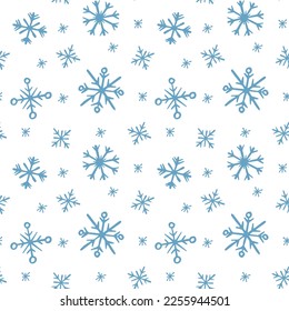 Doodle winter seamless pattern blue snowflakes on white background for gift wrapping, textile and fabric design.