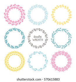 Doodle wreath. Vector hand drawn set of floral round wreaths. Isolated. On white background. Yellow, pink, green, blue and black elements.