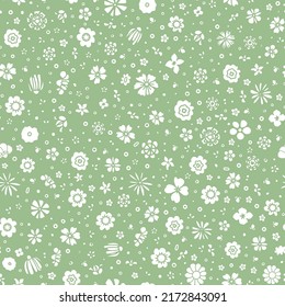 Doodled flowers seamless repeat pattern. Random placed, various vector botany plants illustration all over surface print on lime green background.