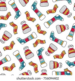 Doodles Christmas seamless pattern. Color vector background, new year theme. Illustration with hat and sock. Design for T-shirt, textile and prints.