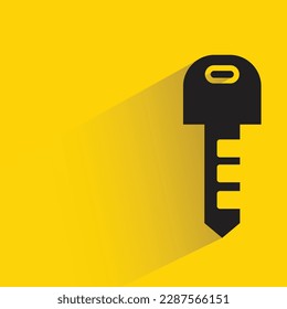door key with shadow on yellow background